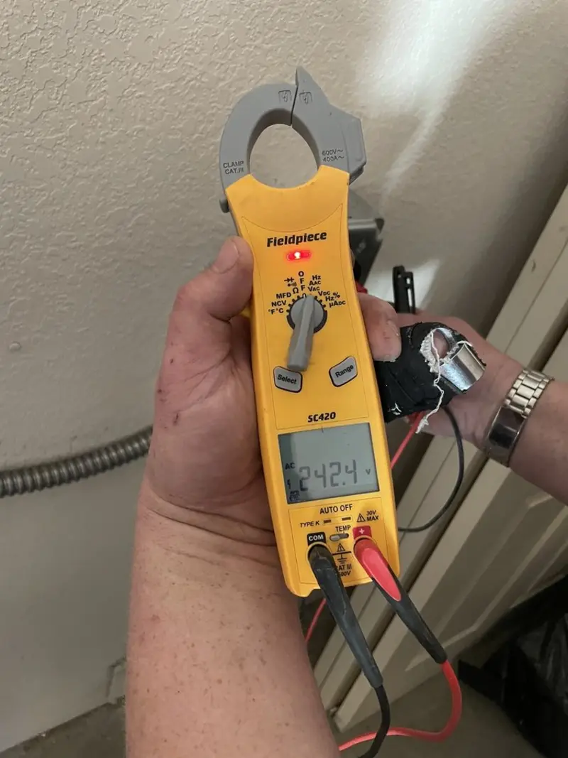 Voltage testing with clamp meter during Electrical Installation Services in Palm Valley